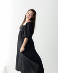 Textured black maxi dress with square neckline from Favored And Common