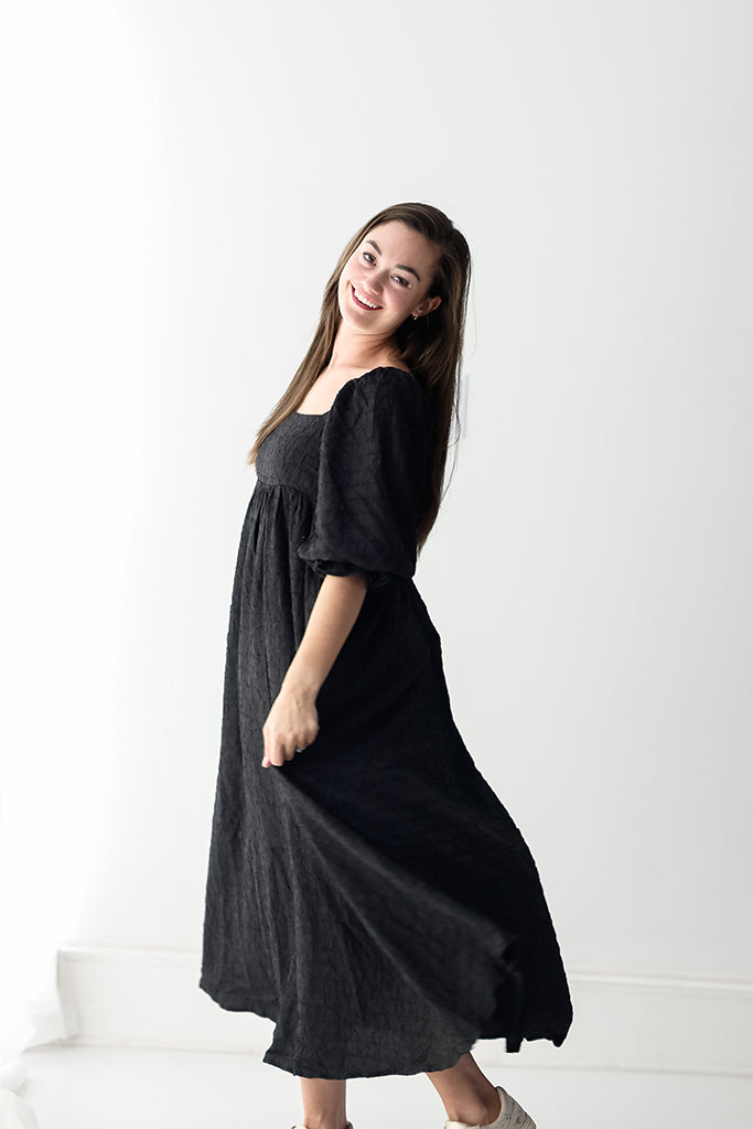 Textured black maxi dress with square neckline from Favored And Common