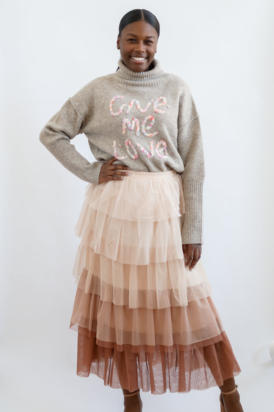 Tiered mesh skirt with turtle neck sweater from Favored And Common in NC