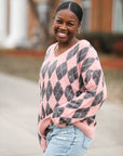 V-neck pink Valentine's Day fuzzy argyle sweater from Favored and Common