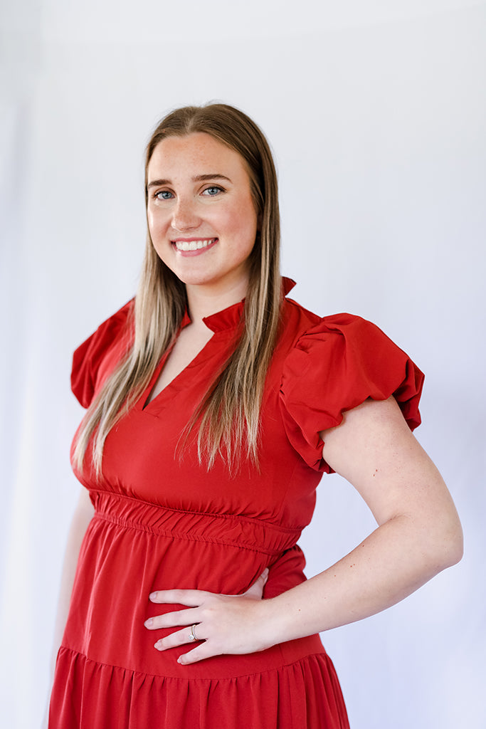 V-neck rust colored midi dress with short bubble sleeves from Favored and Common