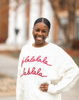 White cable knit sweater with red embroidered letters from Favored And Common