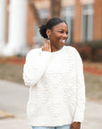 White fuzzy knit sweater with pom pom hearts from Favored And Common