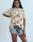 Yellow flowy floral high neck blouse from Favored And Common in NC