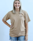 Smiley face tee for women from Favored And Common in NC