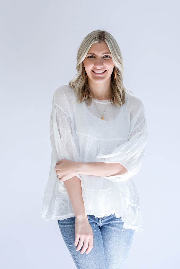 White flowy blouse with raw hem from Favored And Common