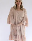 Textured blush pink dress with a square neck line and ruffled hem from Favored And Common