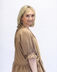 Brown linen half sleeve top with ruffle hem from Favored And Common