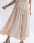 Champagne flowy satin wide leg pants from Favored and Common