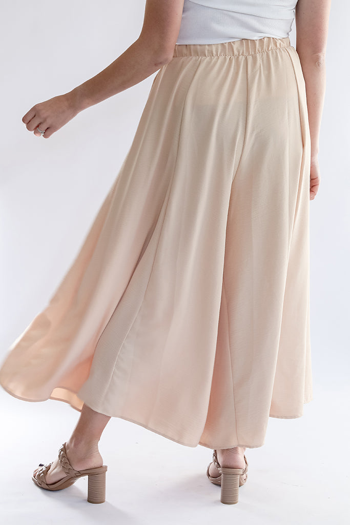 Champagne flowy satin wide leg pants from Favored and Common