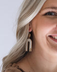 Gold and ivory cow print drop earrings from Favored And Common