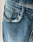 Hi rise straight leg jeans with fringe pocket details from Favored And Common