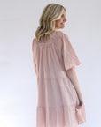 Pink tiered dress with sleeves from Favored And Common in NC