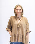 Brown linen blouse with tassel tie and ruffle hem from Favored And Common