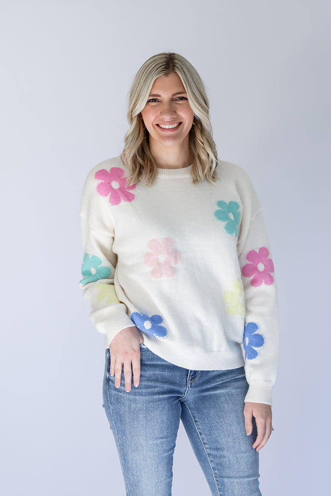 White knit daisy print sweater outfit from Favored And Common in NC