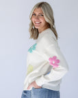 White knit sweater with pastel daisy print for women From Favored And Common