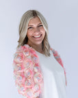 Women's pink blouse with 3D floral sleeve details